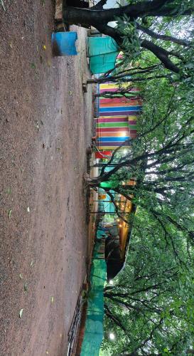 an aerial view of a street with trees at Quietude in Khalapur
