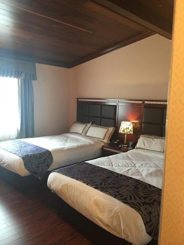 Katil atau katil-katil dalam bilik di The Greensboro Inn