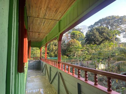 a balcony of a house with a view of trees at Casas Salomão in Santo António