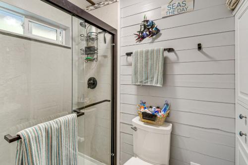 a bathroom with a shower and a toilet at Outdoor Kitchen and Canal Views Cabin in Quilcene! in Seabeck