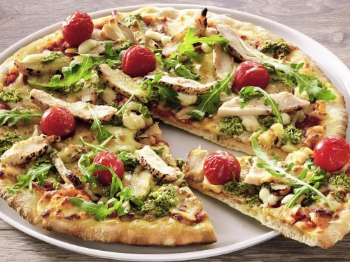 two slices of pizza on a white plate at Ibis Sheffield City in Sheffield