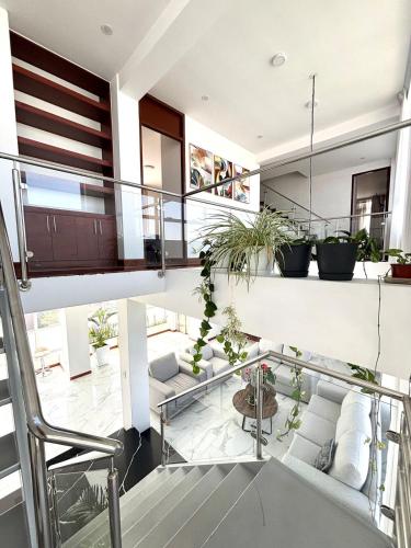 a room with a staircase with potted plants at Arequipa 360 in Paucarpata