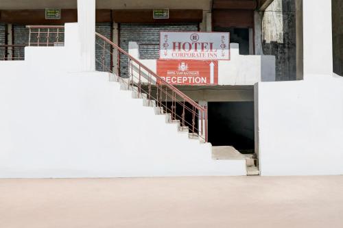 a stairway leading into a building with a hotel sign at HOTEL O YASH RAJ PALACE in Rāe Bareli