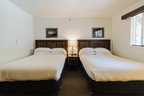 Ένα ή περισσότερα κρεβάτια σε δωμάτιο στο Crystal Mountain Hotels
