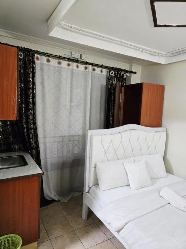 Ένα ή περισσότερα κρεβάτια σε δωμάτιο στο Abby's City Studio