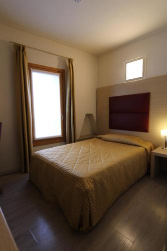 Hotel Villa Materniniにあるベッド