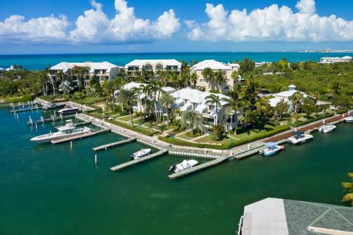an aerial view of a resort with boats in the water at 2 Bdrm Pool Marina View at The Yacht Club E12 in Providenciales