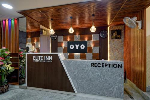 a reception area of a hotel with a reception desk at Hotel O The Pramaan in Kukatpalli
