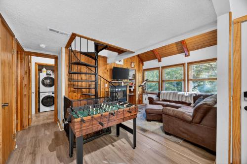 a living room with a foosball table in a room at Mountain Escape with Games & Stargazing cabin in Basye