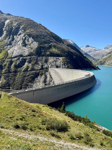a dam on a mountain next to a body of water at AH Carinthia Mallnitz - Carinthia Appartements in Mallnitz