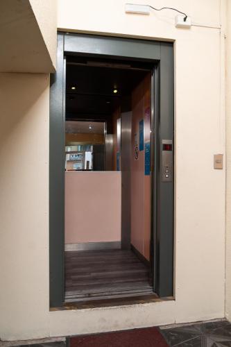 an entrance to a building with a revolving door at Hotel Terranort in Iquique