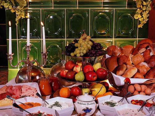 a table filled with different types of fruits and vegetables at Mercure Hotel am Messeplatz Offenburg in Offenburg