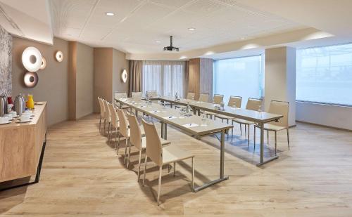 a large conference room with a long table and chairs at NH Imperial Playa in Las Palmas de Gran Canaria