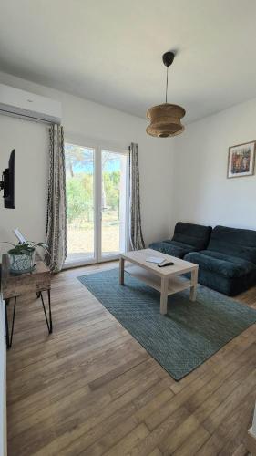Posezení v ubytování Appartement en maison d'hôtes