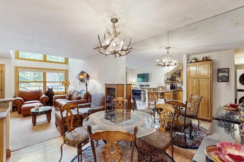 a living room with a table and chairs at Cimarron Mountain Retreat in Telluride