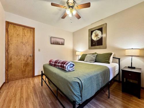 a bedroom with a bed and a ceiling fan at Forest View Family Home in Pollock Pines