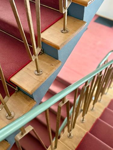 a set of stairs in a room with wooden seats at AH Carinthia Mallnitz - Carinthia Appartements in Mallnitz