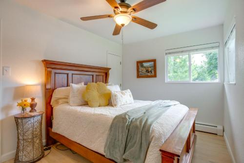 a bedroom with a bed with a ceiling fan at Modern Creekside Home 9 Mi to Downtown Denver in Lakewood