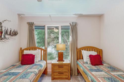 Ένα ή περισσότερα κρεβάτια σε δωμάτιο στο Inlet Cove 23