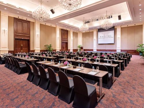 a banquet hall with tables and chairs in a room at Sofitel Angkor Phokeethra Golf & Spa Resort in Siem Reap