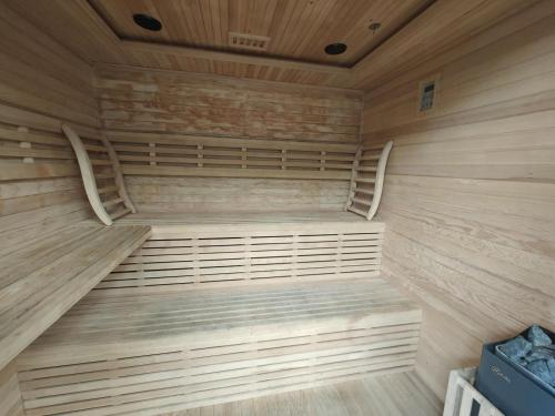 a large wooden sauna with wooden floors and ceilings at 2 Bed in Newtonmore oc-e32418 in Newtonmore