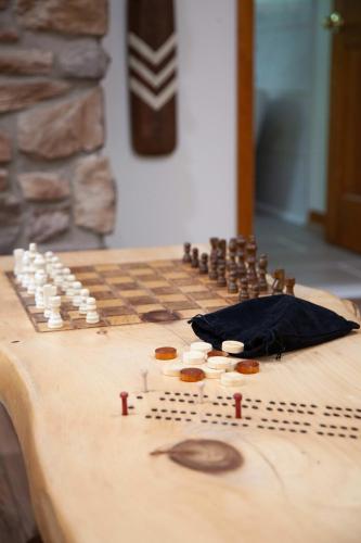 a chess board on a wooden table at The Cliff House Hot Tub Kayaks & Game Room in Dresden