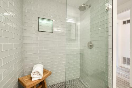 a bathroom with a shower with a glass door at River Run # 15 by Tahoe Getaways - 2 BR w Private Balcony, River Views & Shuttle in Alpine Meadows
