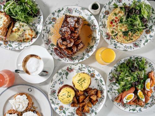 a table with many plates of food on it at Sofitel Lafayette Square Washington DC in Washington