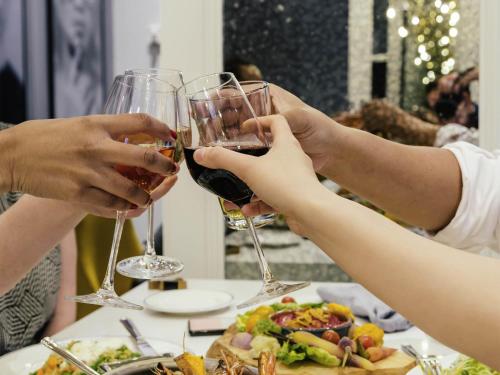 a group of people holding glasses of wine at Sofitel Lafayette Square Washington DC in Washington