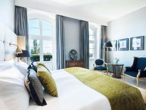a bedroom with a large white bed and a window at Sofitel Grand Sopot in Sopot