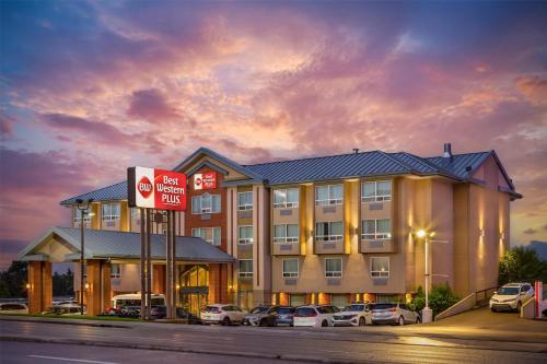 a hotel with a no parking sign in front of it at Best Western PLUS Calgary Centre Inn in Calgary