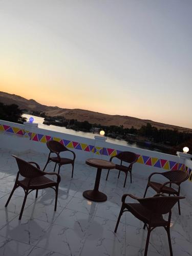 a group of chairs and a table on a patio at Reagan House in Aswan