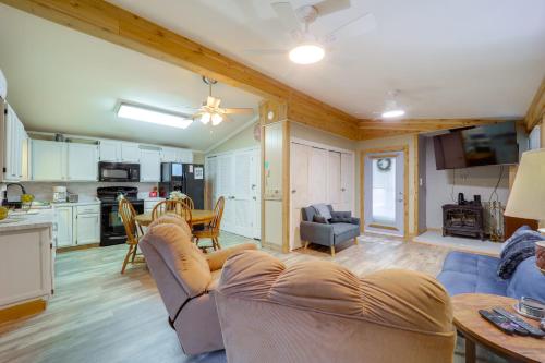 a living room and kitchen with a couch and a table at Mtn Home with Deck and Community Amenities in Newland in Montezuma