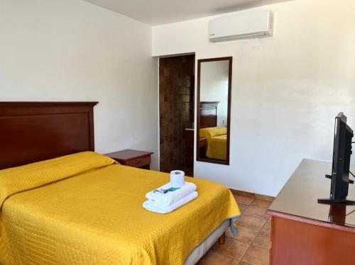 Postel nebo postele na pokoji v ubytování Resort Misión del Mar