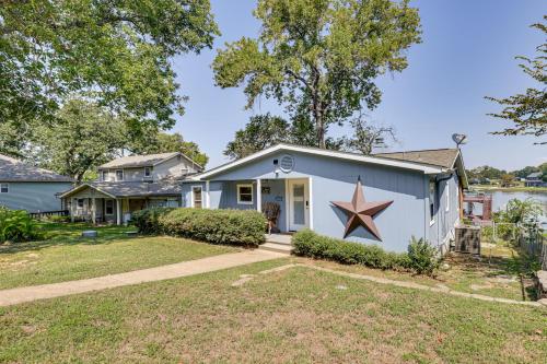 a house with a star painted on the side of it at Lakefront Escape with Game Room and Dock in Mabank! in Enchanted Oaks