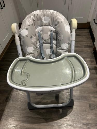a childs rocking chair with a childs car seat at Blissful Lodge Haven Lakeland in Flookburgh