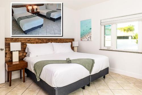 a bedroom with a large bed and a window at 2 Bdrm Garden Marina View at The Yacht Club C4 in Providenciales
