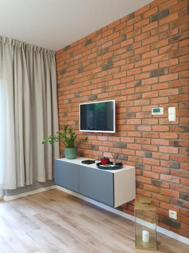TV a/nebo společenská místnost v ubytování Garden Haven