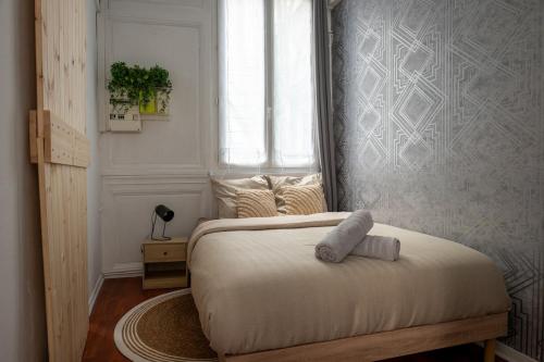 Postel nebo postele na pokoji v ubytování Au cœur de Rouen