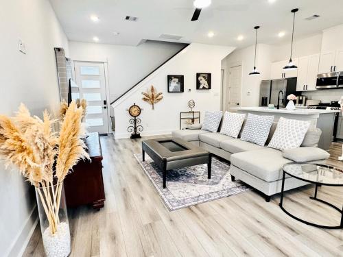 a living room with a couch and a table at Colorful Dining Experience in Cozy Getaway in Houston
