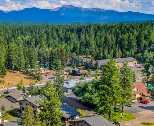 an aerial view of a town with trees and mountains at The Loft- Steps from the Lake & Dining- This newly renovated 2 bedroom loft in the heart of McCall in McCall
