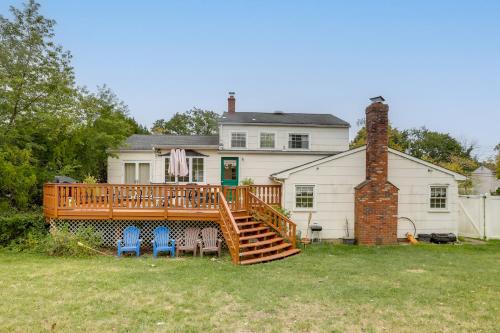 a large house with a deck and two chairs at Somerset Home with Large Yard Near Parks and Trails in Somerset