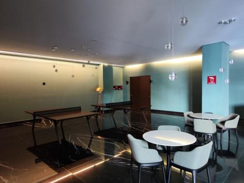 a room with tables and chairs in a building at Distrito Chapultepec in Guadalajara