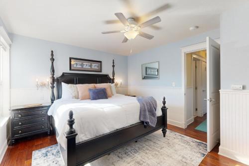 a bedroom with a bed and a ceiling fan at Newport Sunshine #C208 in Newport