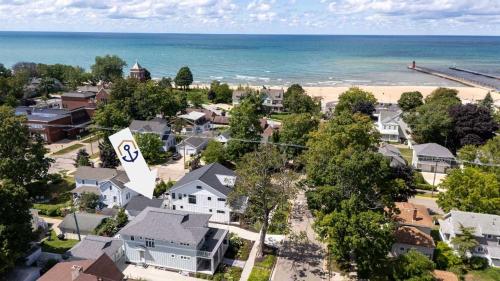 an aerial view of a residential neighborhood with the beach at Lux Beach Home Lake Views Firepit in South Haven