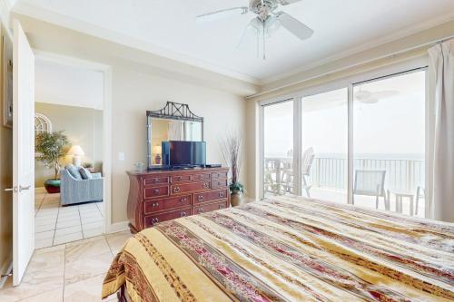 a bedroom with a large bed and a large window at Regency Isle 903 in Perdido Key