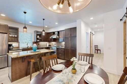 a kitchen with a table and chairs and a dining room at Serenity at Deerhaven #B in Gold Beach