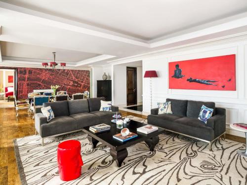 a living room with a couch and a table at Sofitel Mumbai BKC in Mumbai