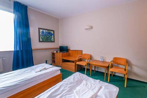 Postel nebo postele na pokoji v ubytování Bobrowy Resort