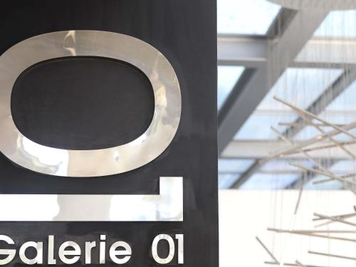 a sign on a building with a circle on it at Sofitel Casablanca Tour Blanche in Casablanca